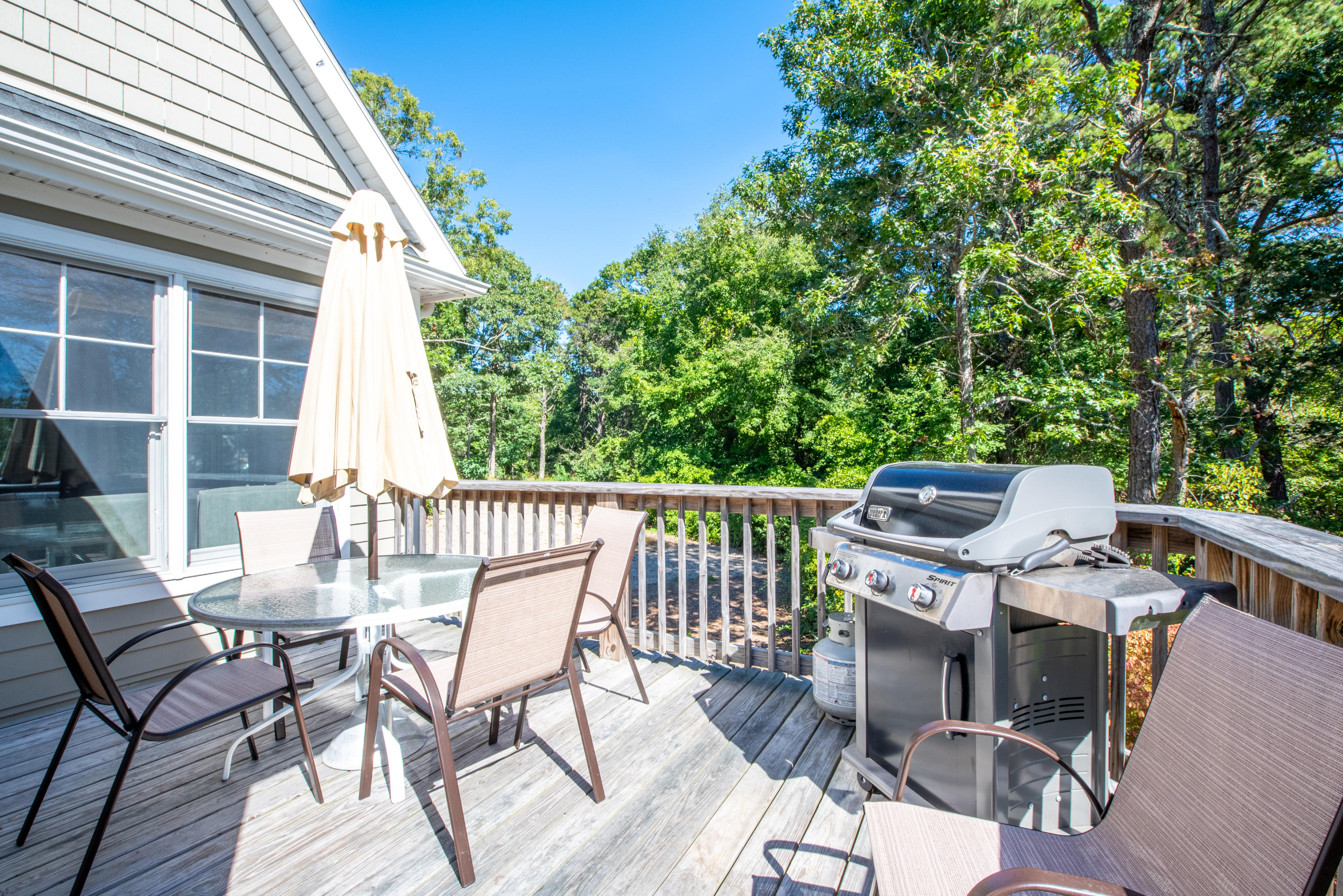 100 Peace Valley Road Wellfleet, MA 02667 - Photo 17 of 33 a view of a patio with a table and chairs
