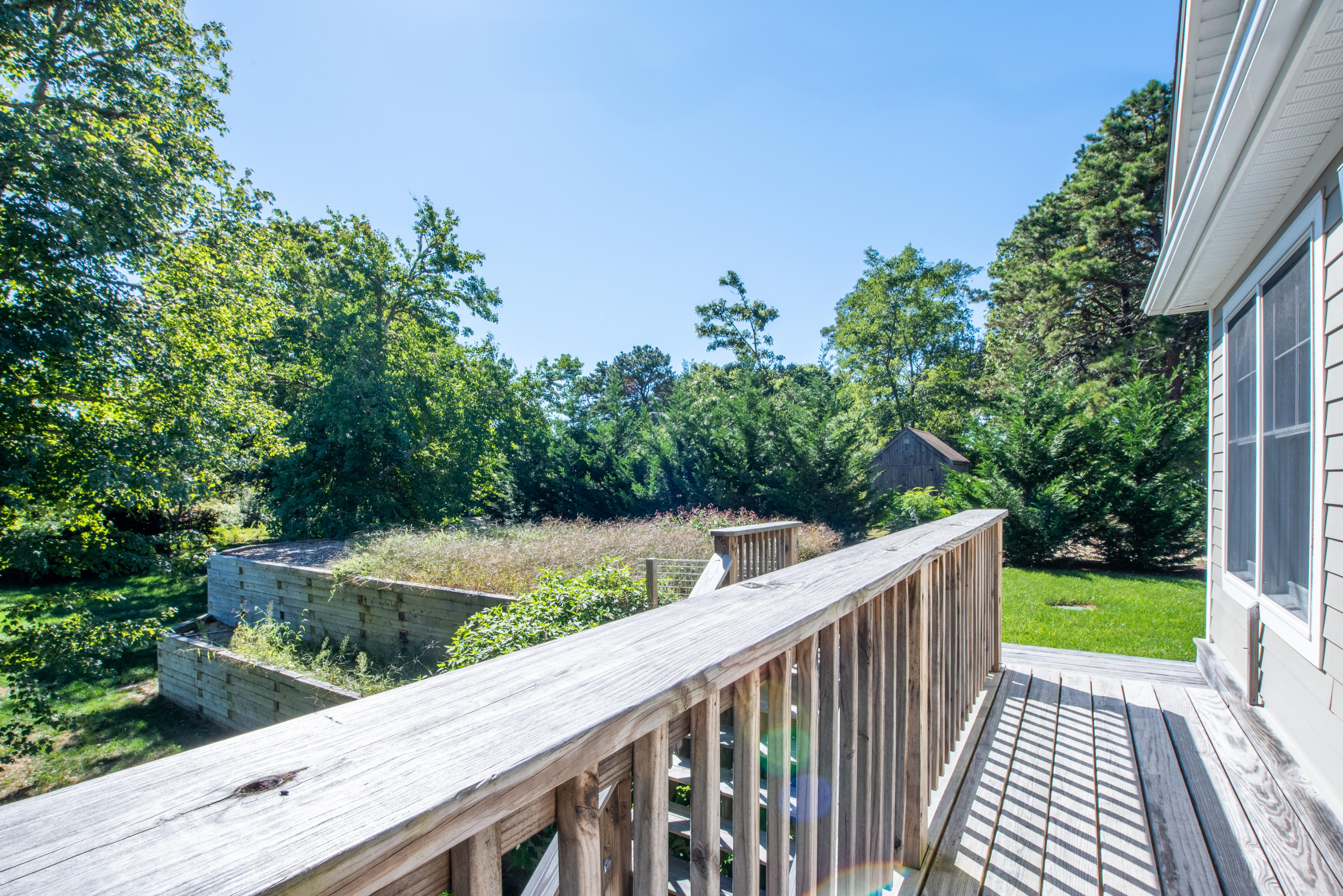 100 Peace Valley Road Wellfleet, MA 02667 - Photo 18 of 33 a view of a yard with wooden fence