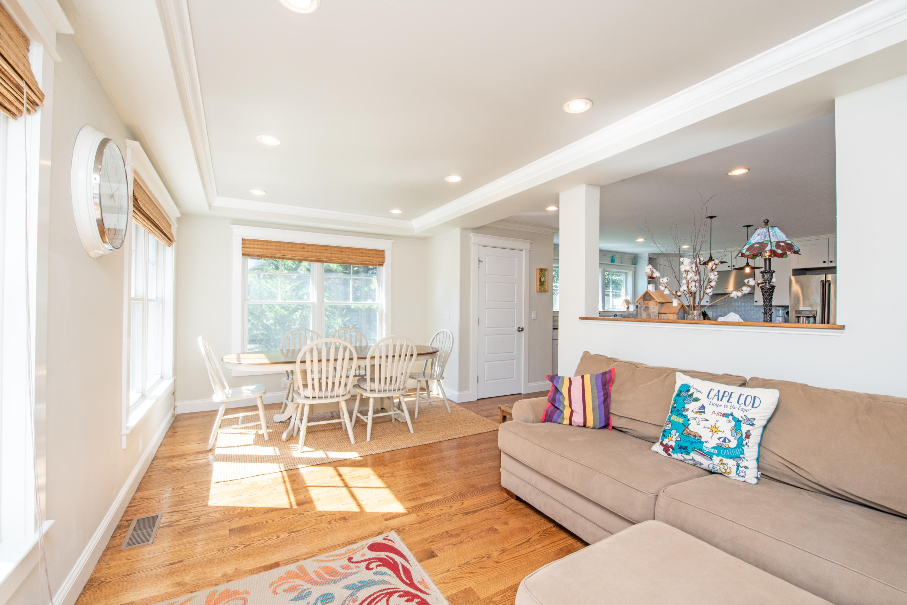 100 Peace Valley Road Wellfleet, MA 02667 - Photo 19 of 33 a living room with furniture and a dining table with wooden floor