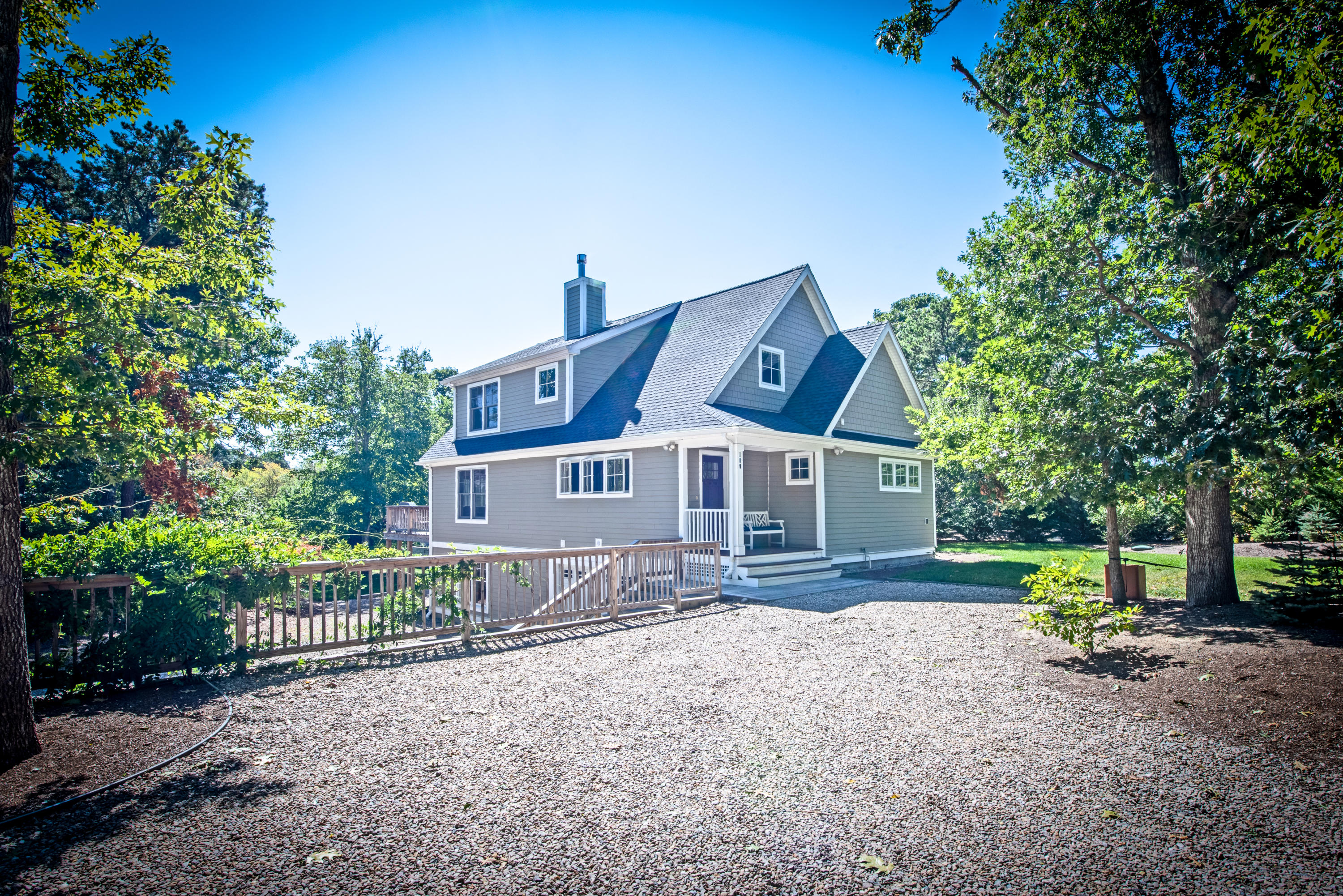 100 Peace Valley Road Wellfleet, MA 02667 - Photo 2 of 33 a front view of a house with a yard