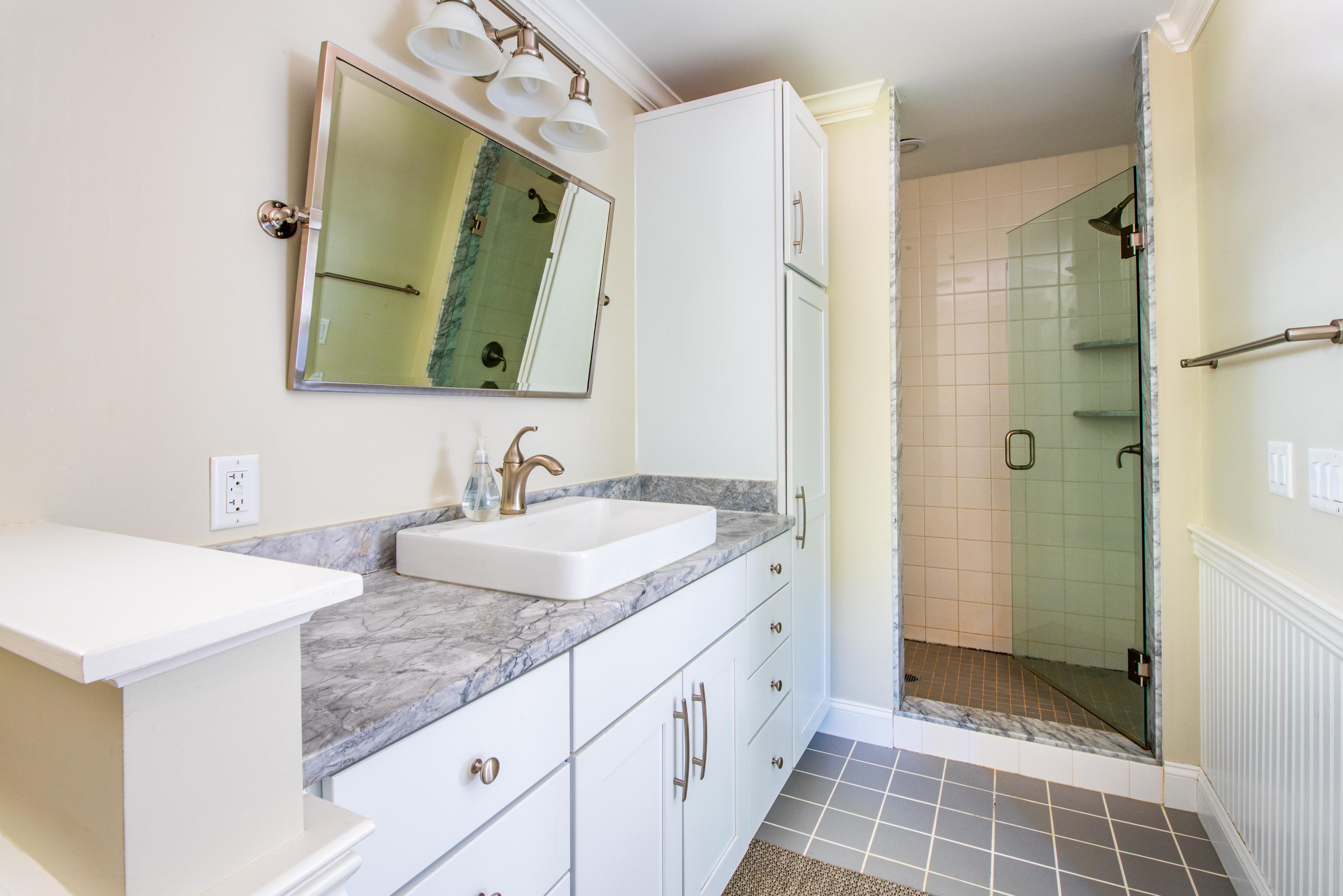 100 Peace Valley Road Wellfleet, MA 02667 - Photo 24 of 33 a bathroom with a granite countertop double vanity sink mirror and shower