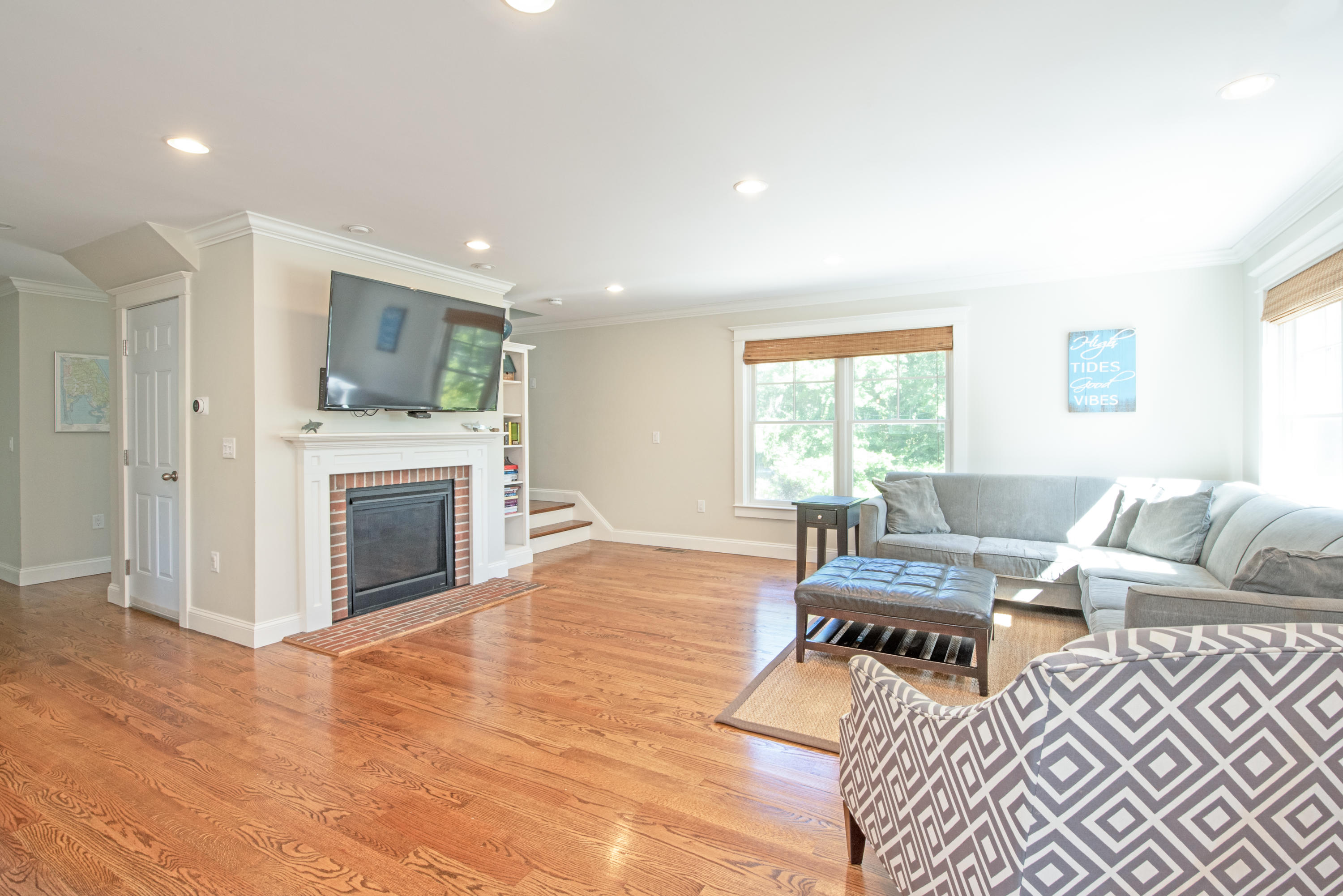 100 Peace Valley Road Wellfleet, MA 02667 - Photo 9 of 33 a living room with furniture a fireplace and a flat screen tv
