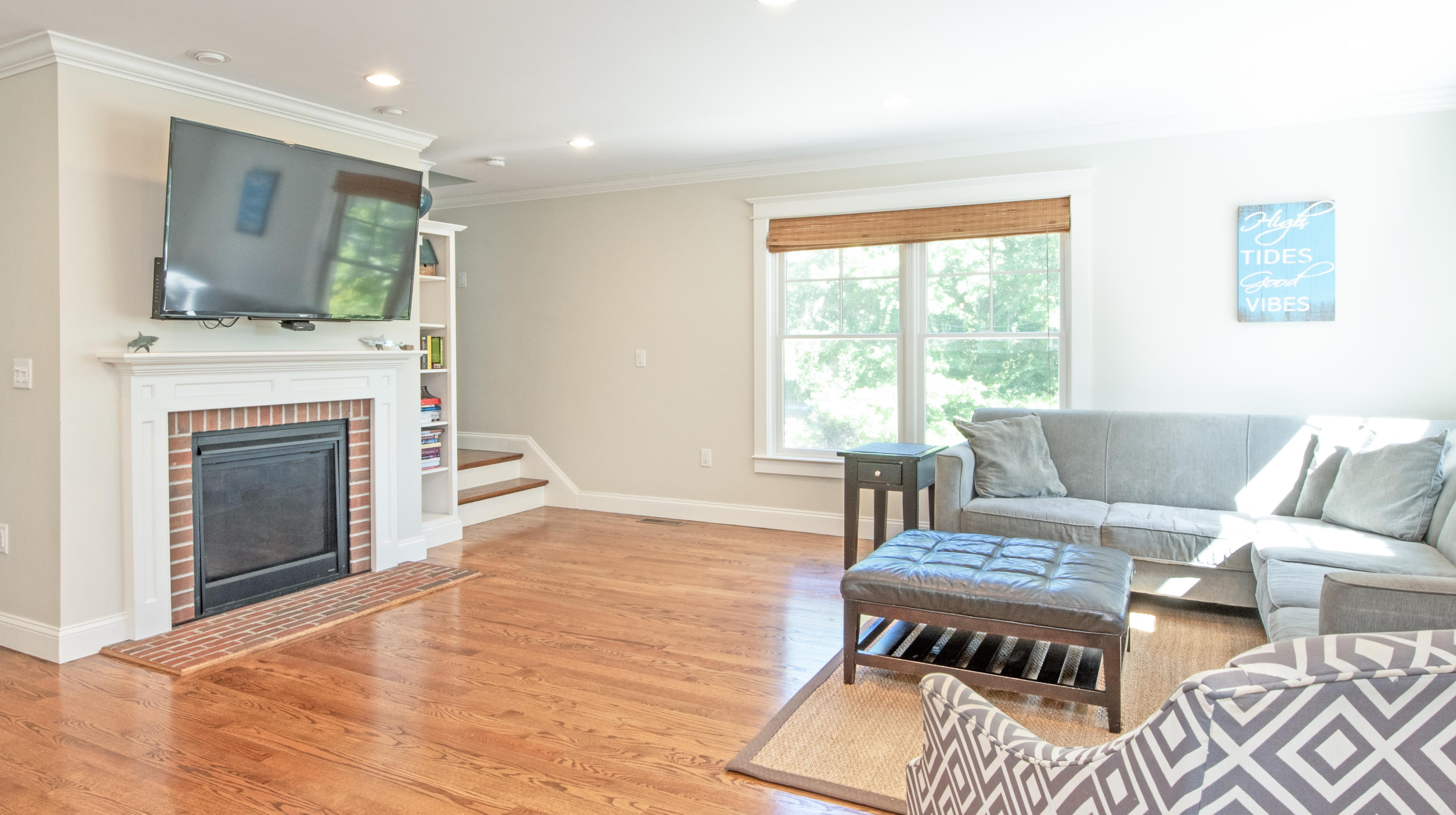 100 Peace Valley Road Wellfleet, MA 02667 - Photo 10 of 33 a living room with furniture and a fireplace