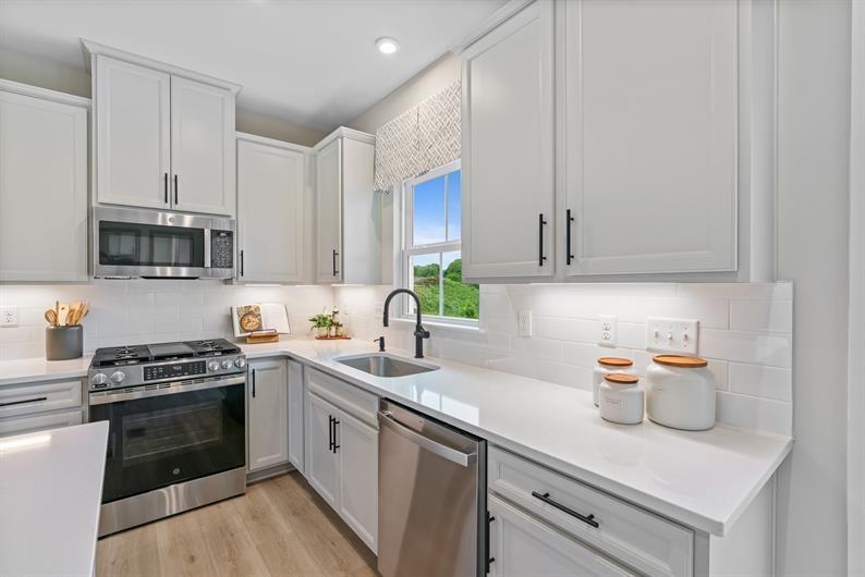 178 Elk Rdg Drive Moon Township, PA 15108 - Photo 5 of 21 a kitchen with stainless steel appliances granite countertop a sink a stove and cabinets