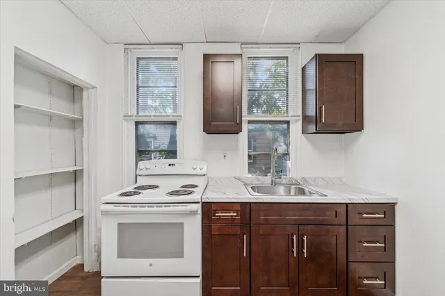 a bathroom with a sink vanity and mirror