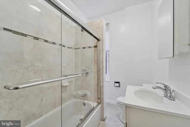 a bathroom with a sink a mirror and a shower