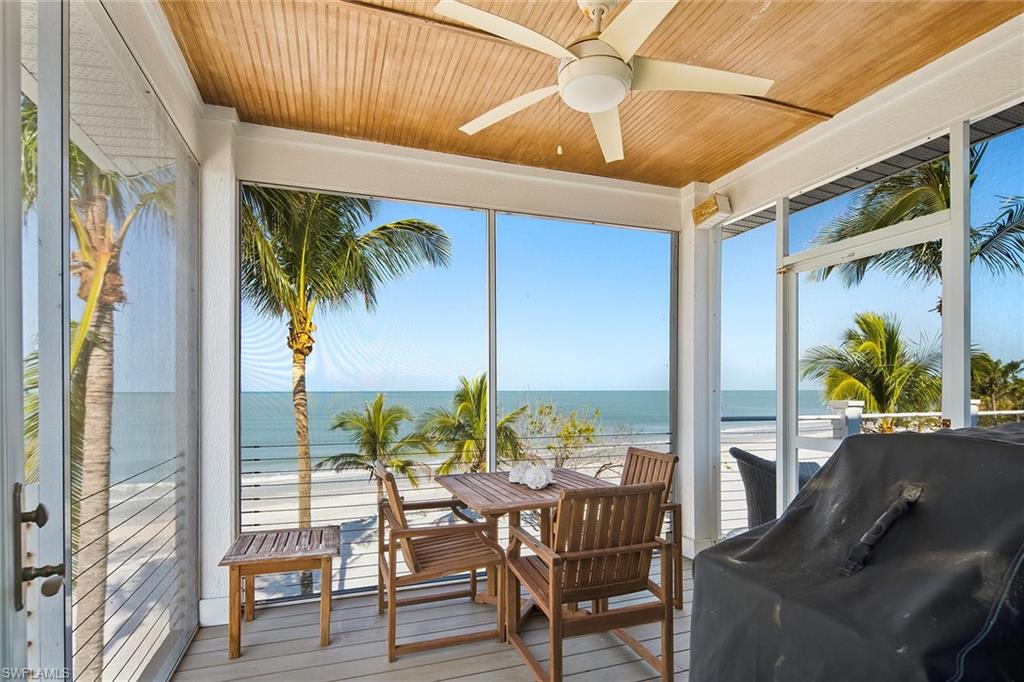 11687 Keewaydin Naples, FL 34113 - Photo 11 of 49 a view of an outdoor dining space with furniture