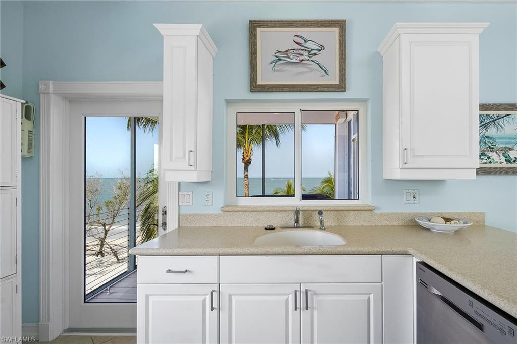 11687 Keewaydin Naples, FL 34113 - Photo 20 of 49 a bathroom with a sink and a mirror