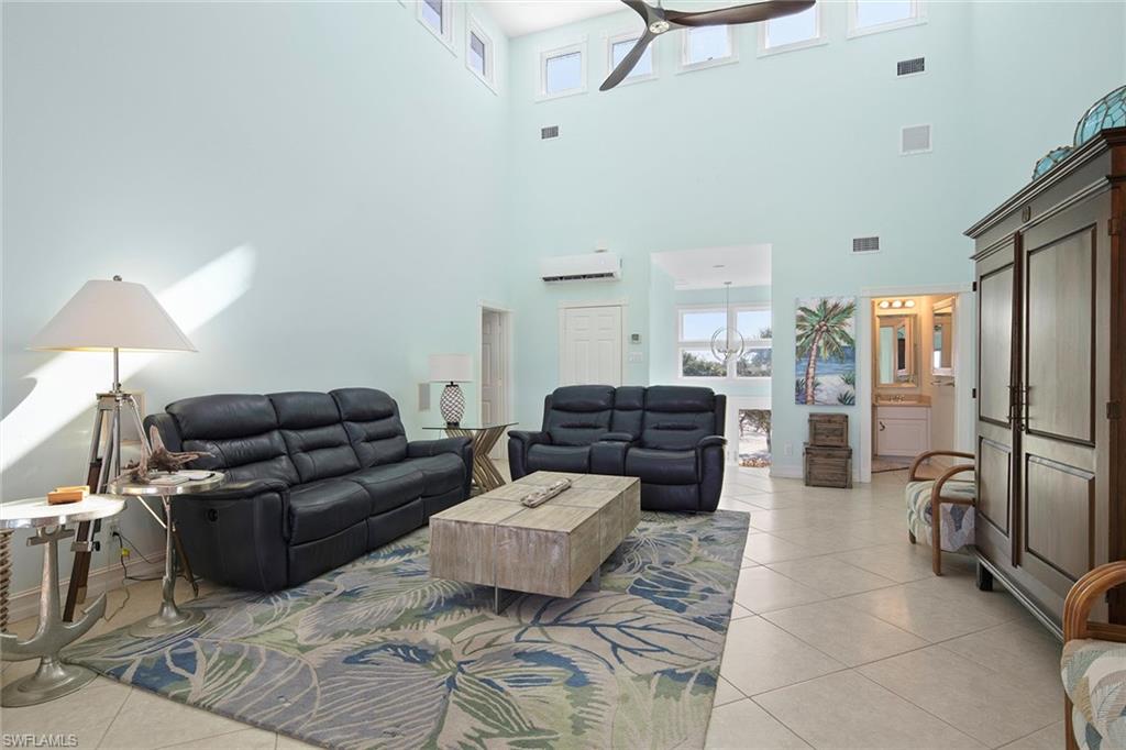 11687 Keewaydin Naples, FL 34113 - Photo 21 of 49 a living room with furniture