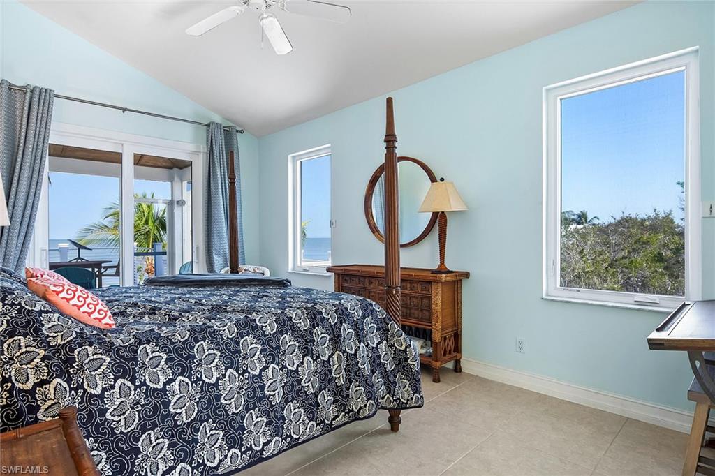 11687 Keewaydin Naples, FL 34113 - Photo 22 of 49 a bedroom with bed and a window