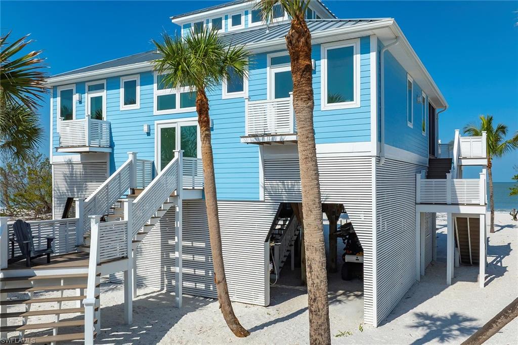 11687 Keewaydin Naples, FL 34113 - Photo 30 of 49 a front view of a house with stairs