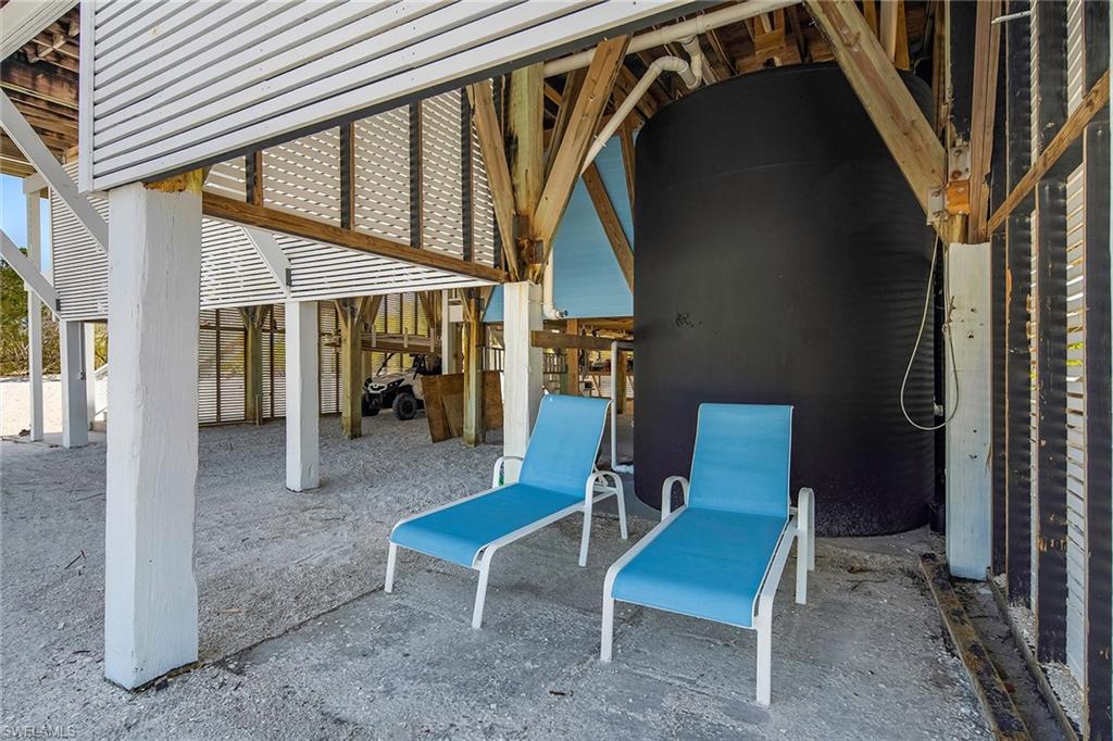 11687 Keewaydin Naples, FL 34113 - Photo 31 of 49 a view of two chairs in the patio