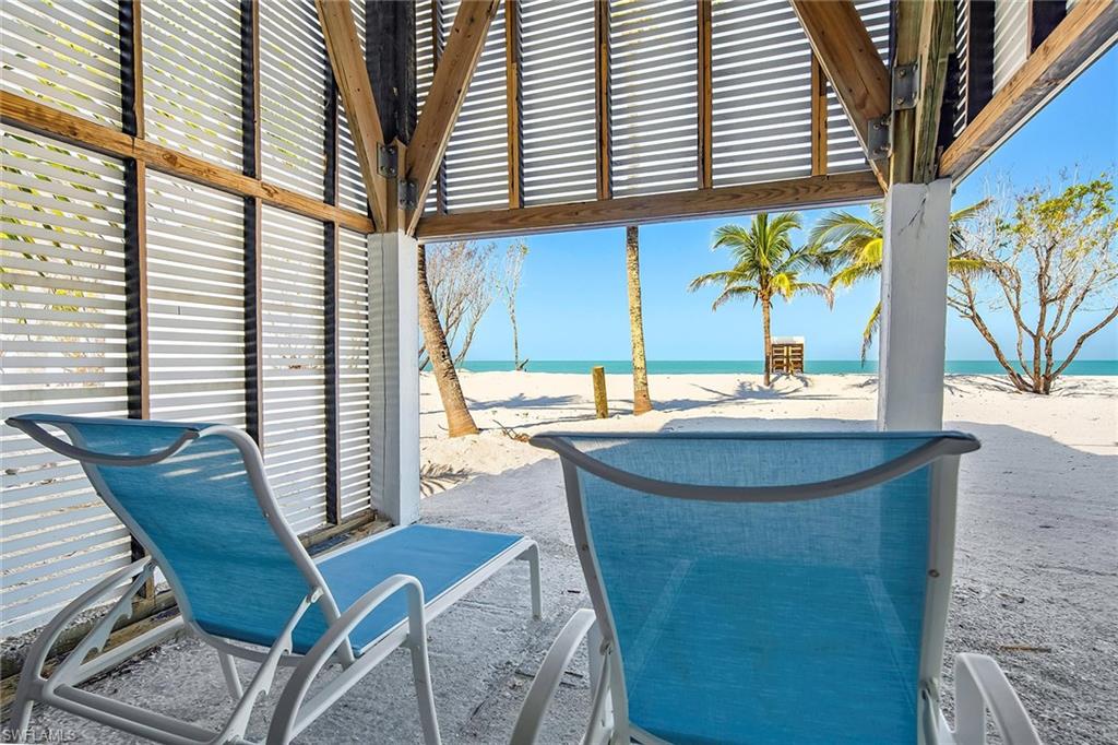 11687 Keewaydin Naples, FL 34113 - Photo 32 of 49 a view of a balcony with chairs