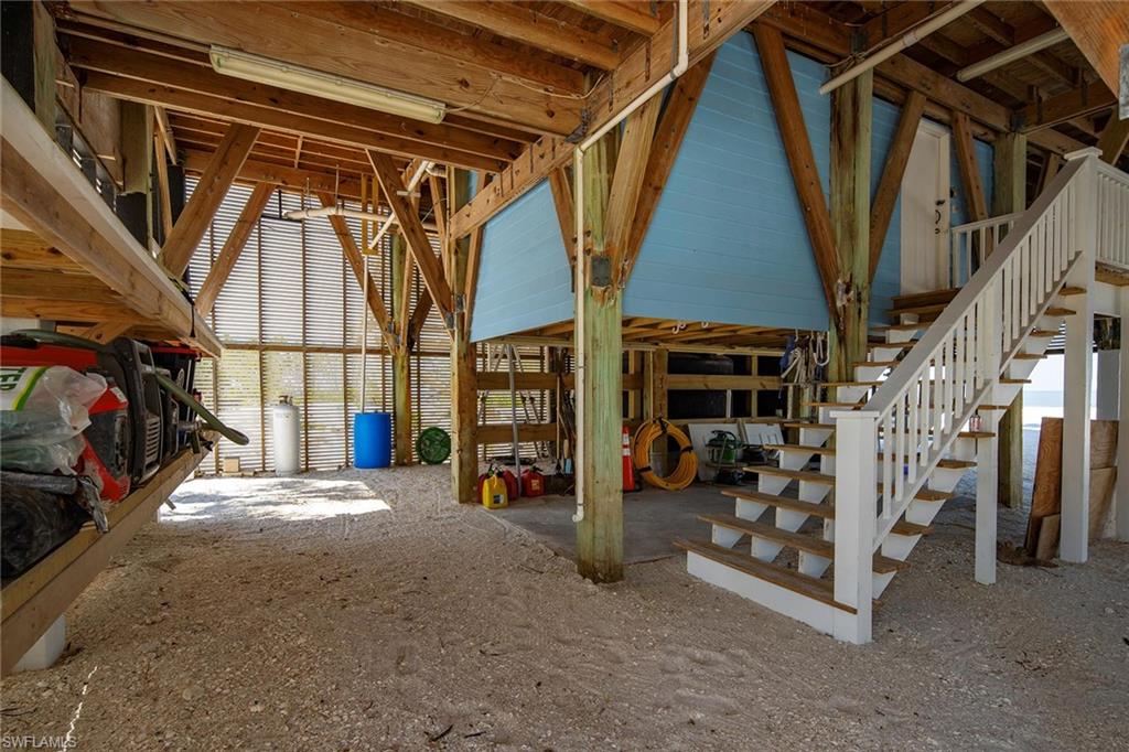 11687 Keewaydin Naples, FL 34113 - Photo 33 of 49 a view of water heater room with stairs