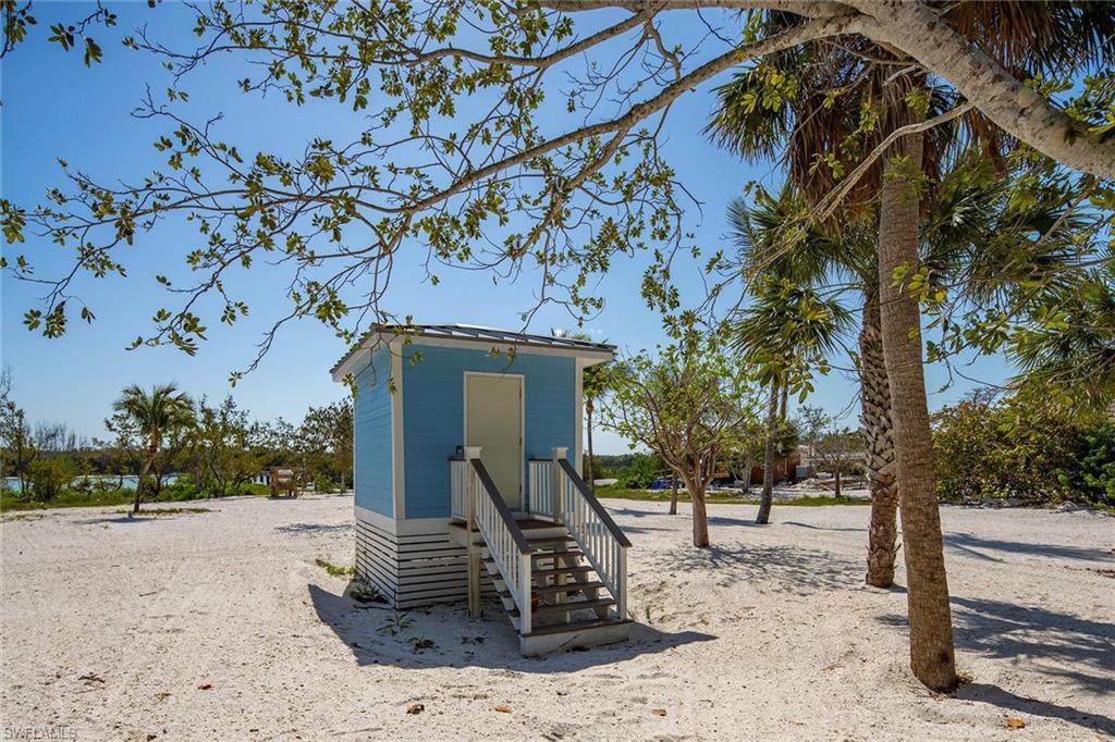 11687 Keewaydin Naples, FL 34113 - Photo 37 of 49 a front view of a house with a yard
