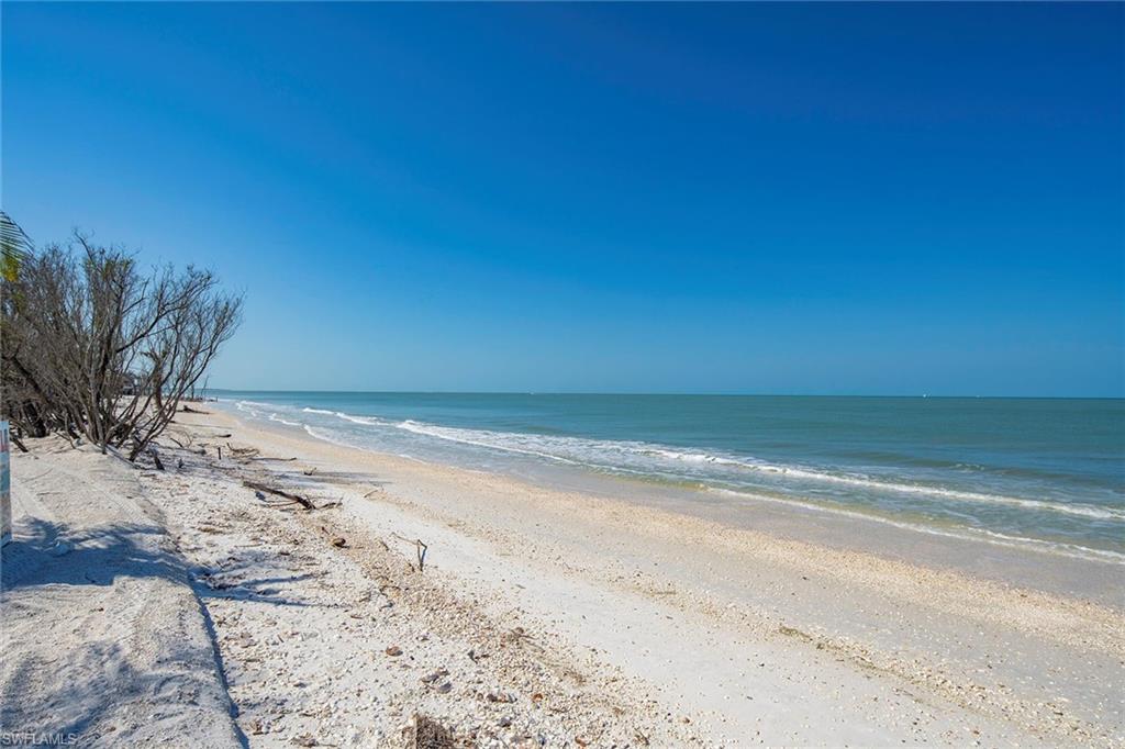 11687 Keewaydin Naples, FL 34113 - Photo 42 of 49 a view of a beach with a mountain view