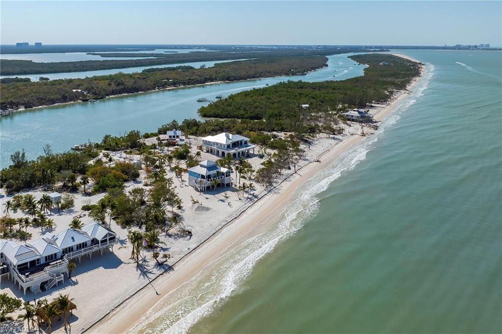 11687 Keewaydin Naples, FL 34113 - Photo 47 of 49 a view of a lake with a yard