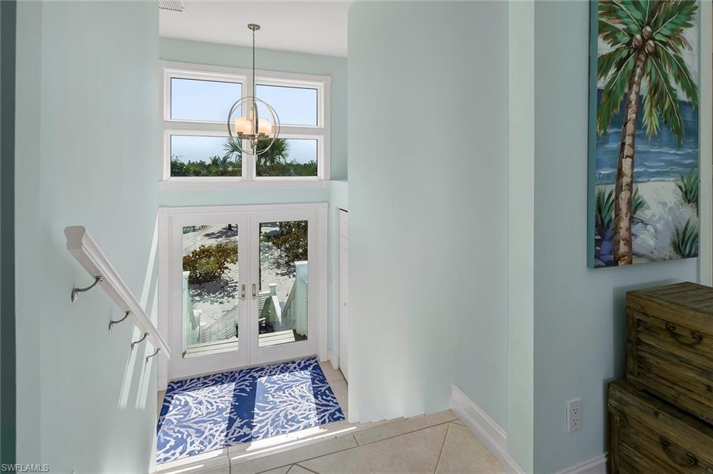 11687 Keewaydin Naples, FL 34113 - Photo 5 of 49 a view of a hallway to a livingroom with furniture