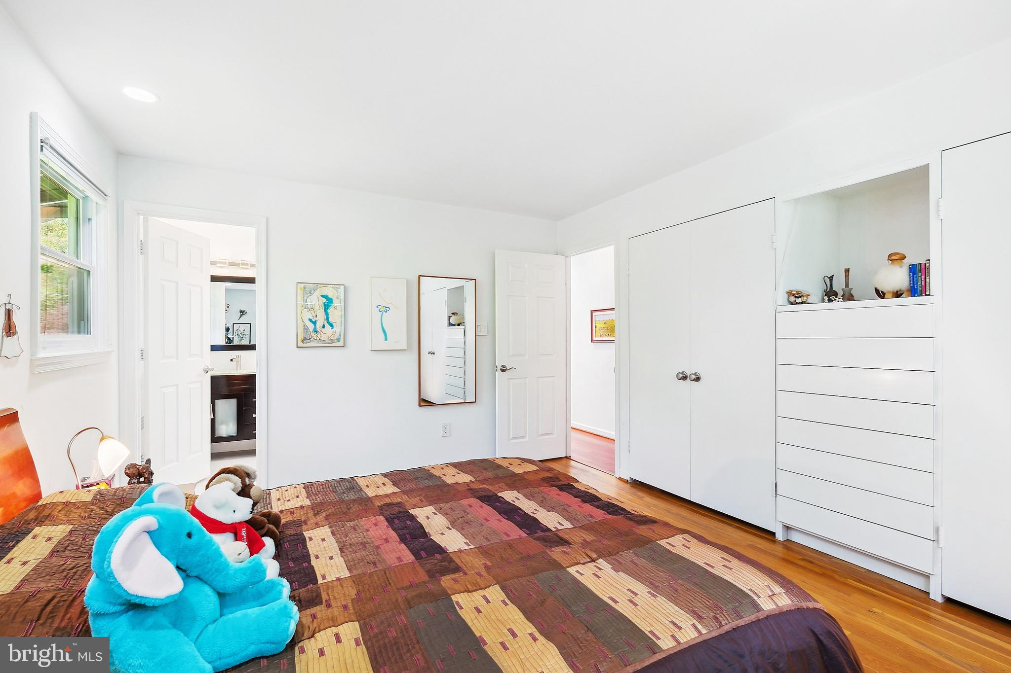 12012 Coldstream Drive Potomac, MD 20854 - Photo 14 of 42 a bedroom with a bed and wooden floor