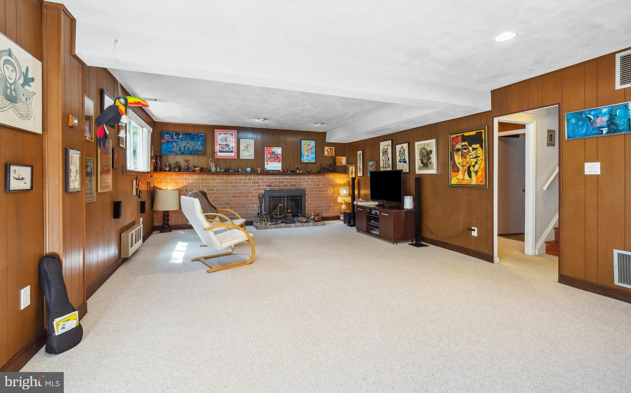 12012 Coldstream Drive Potomac, MD 20854 - Photo 21 of 42 a living room with furniture and a flat screen tv