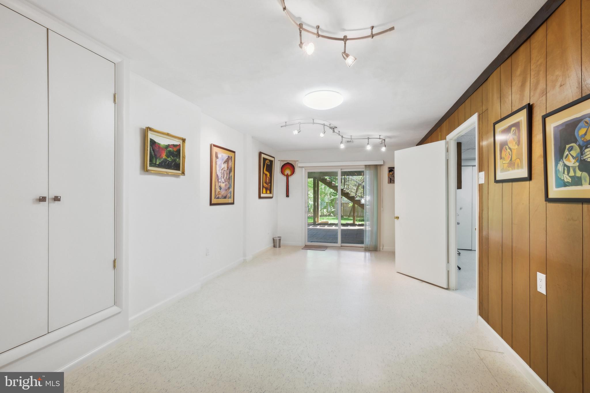 12012 Coldstream Drive Potomac, MD 20854 - Photo 23 of 42 a view of a livingroom with wooden floor and a ceiling fan