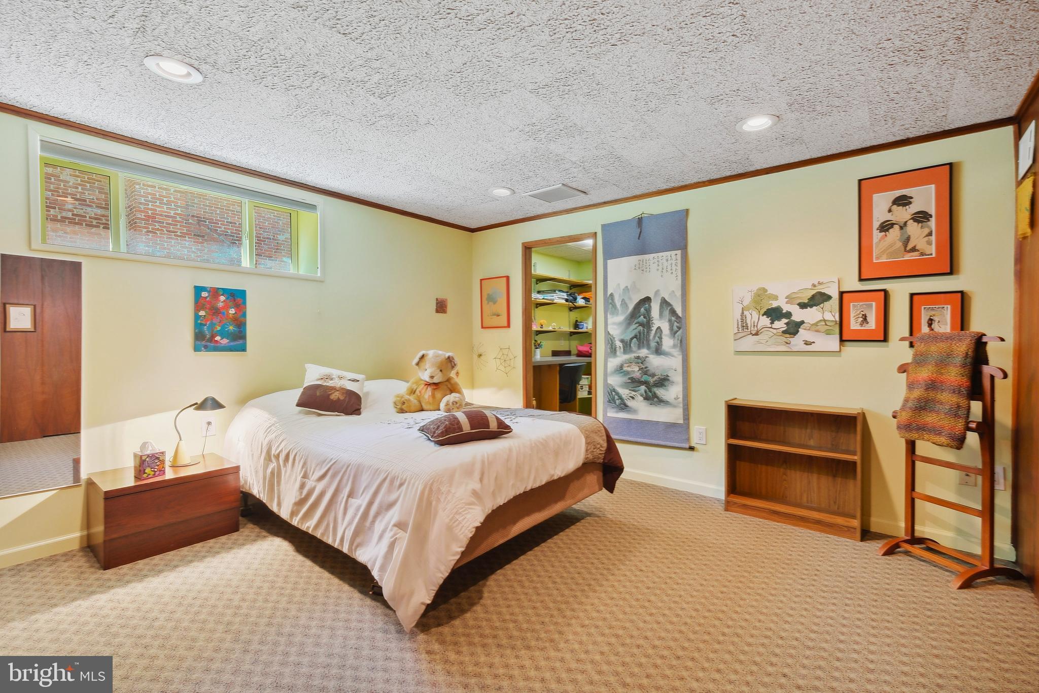 12012 Coldstream Drive Potomac, MD 20854 - Photo 25 of 42 a bedroom with a bed and a couch