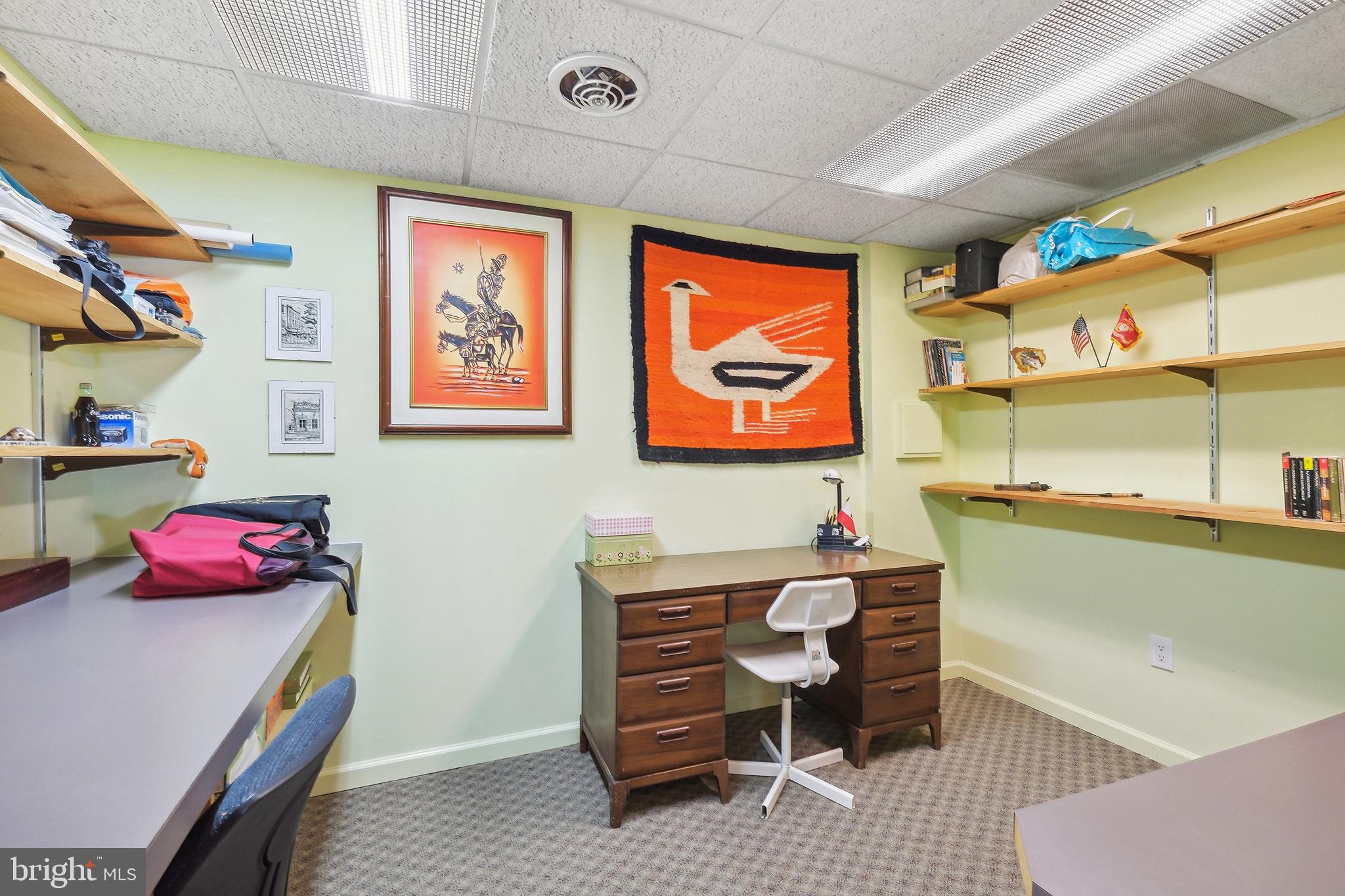 12012 Coldstream Drive Potomac, MD 20854 - Photo 28 of 42 a room with furniture a rug and a window