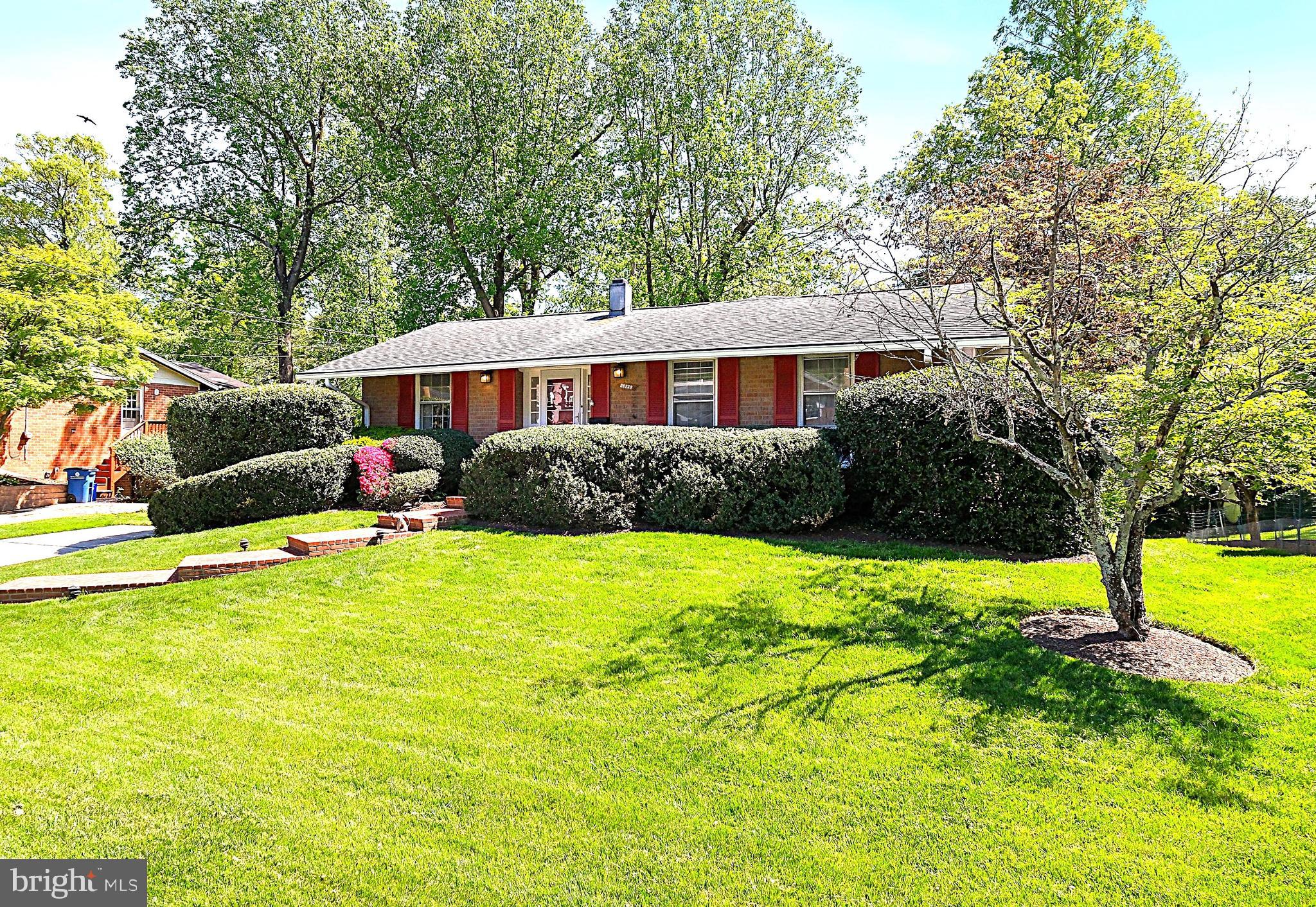 12012 Coldstream Drive Potomac, MD 20854 - Photo 3 of 42 a view of backyard of house with green space
