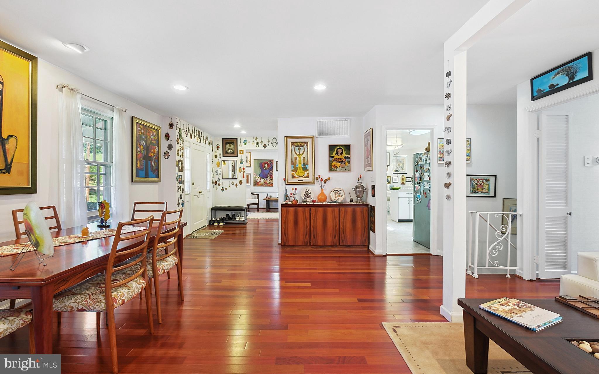 12012 Coldstream Drive Potomac, MD 20854 - Photo 7 of 42 a living room with furniture kitchen view and a wooden floor