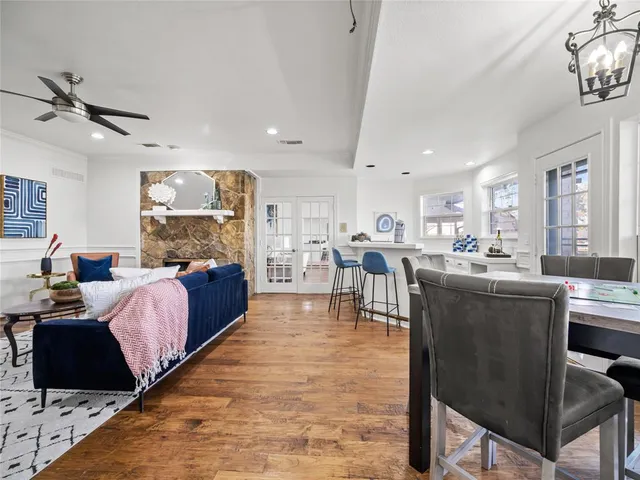 a living room with lots of furniture and kitchen view