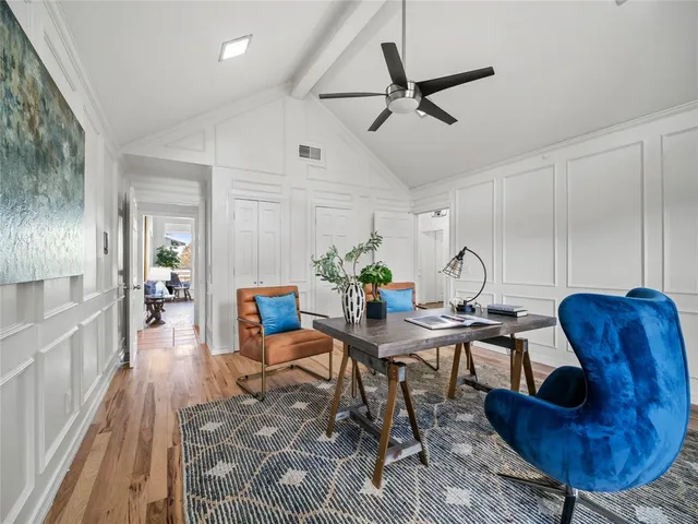 a work room with furniture and a rug