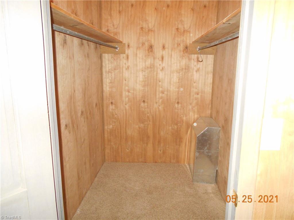 737 Old Camp Road Denton, NC 27239 - Photo 22 of 25 Walk in closet in primary bedroom