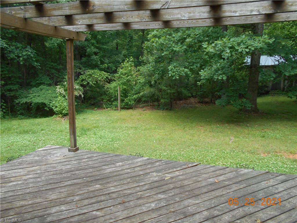 737 Old Camp Road Denton, NC 27239 - Photo 25 of 25 Back deck with view of wired storage building