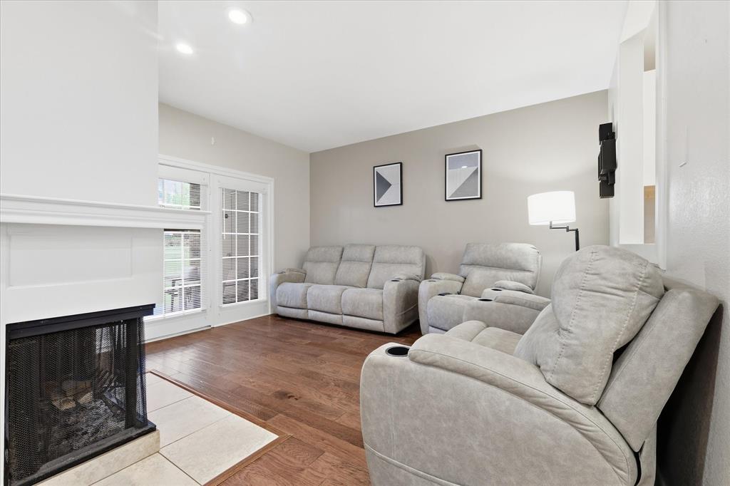 14277 Preston Road, Unit 615 Dallas, TX 75254 - Photo 6 of 20 a living room with furniture and a fireplace