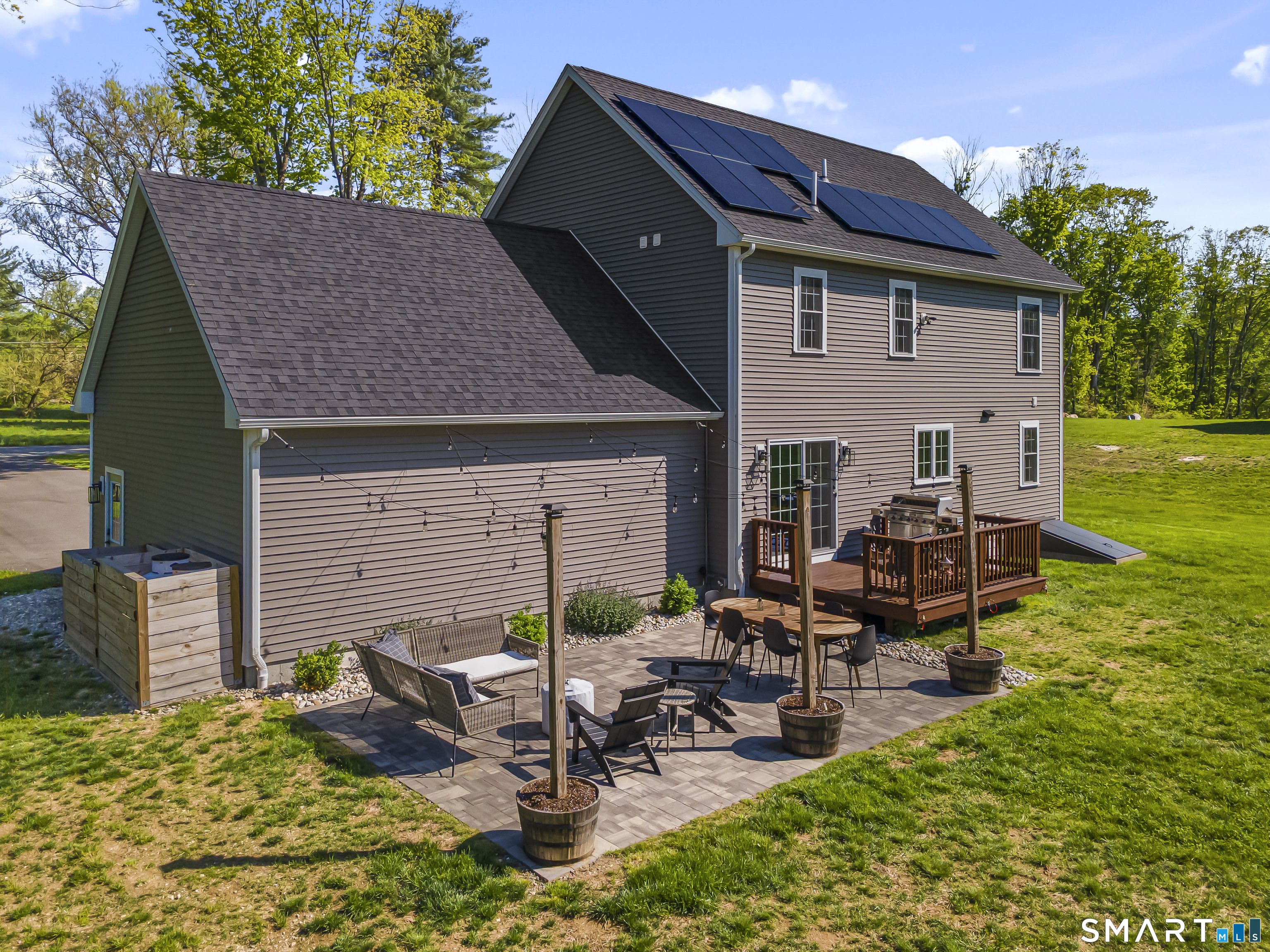 29 Beecher Road Brooklyn, CT 06234 - Photo 6 of 40 a view of a house with backyard sitting area and garden