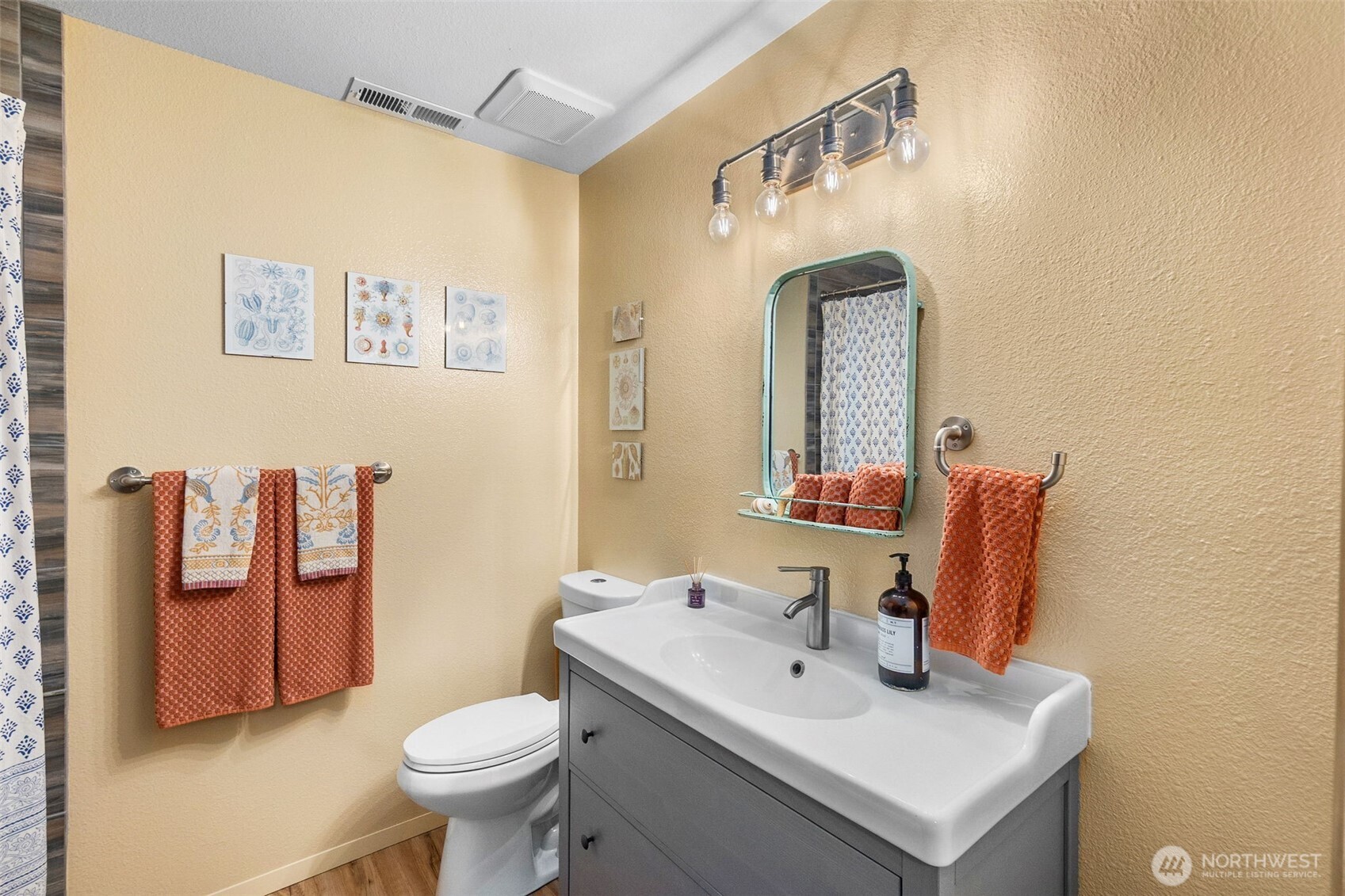 6028 Northill Loop Southwest Olympia, WA 98512 - Photo 24 of 38 a bathroom with a toilet sink and mirror