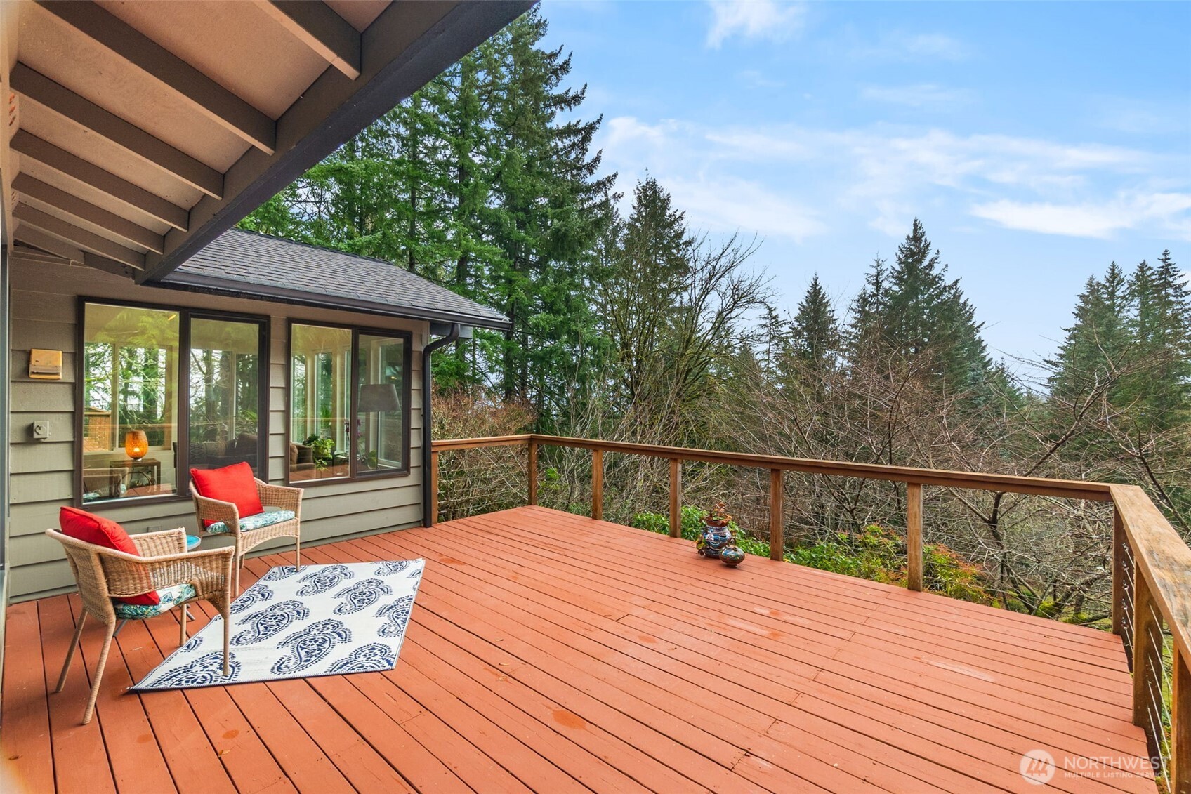 6028 Northill Loop Southwest Olympia, WA 98512 - Photo 7 of 38 a balcony with wooden floor and outdoor seating