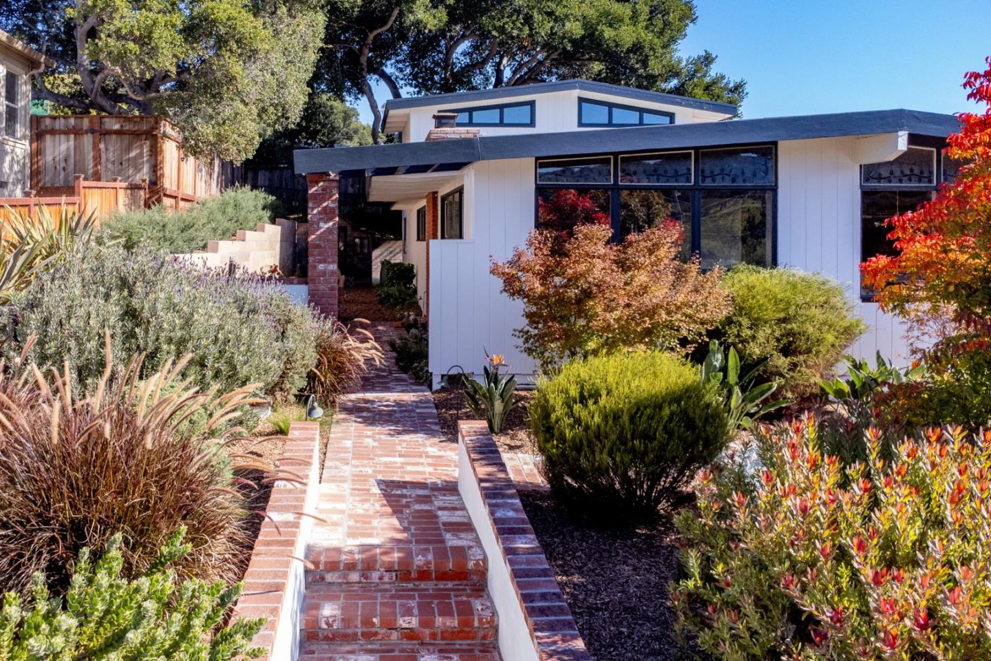 a front view of a house with garden