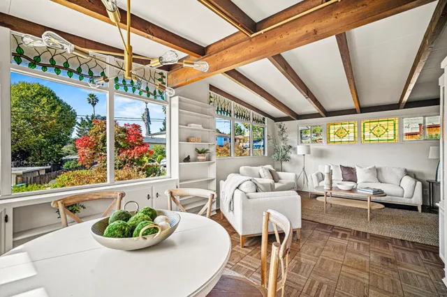 a outdoor dining area with furniture and garden view