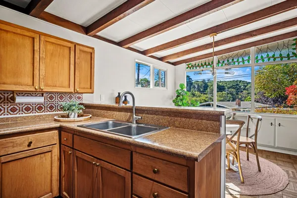 a kitchen with a sink and cabinets