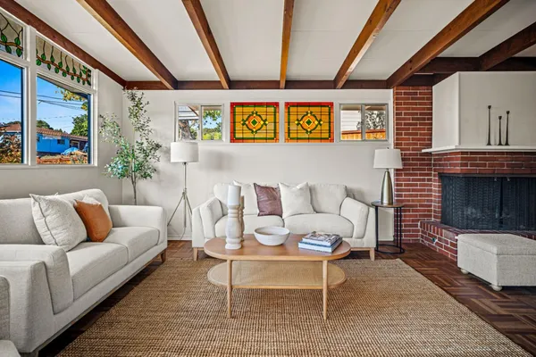 a living room with furniture and a fireplace