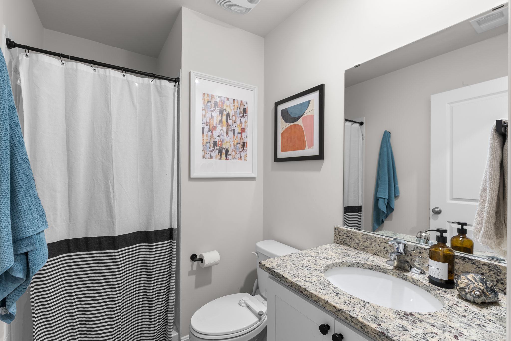 8656 Walter Martz Road Frederick, MD 21702 - Photo 26 of 30 a bathroom with a granite countertop sink and a mirror