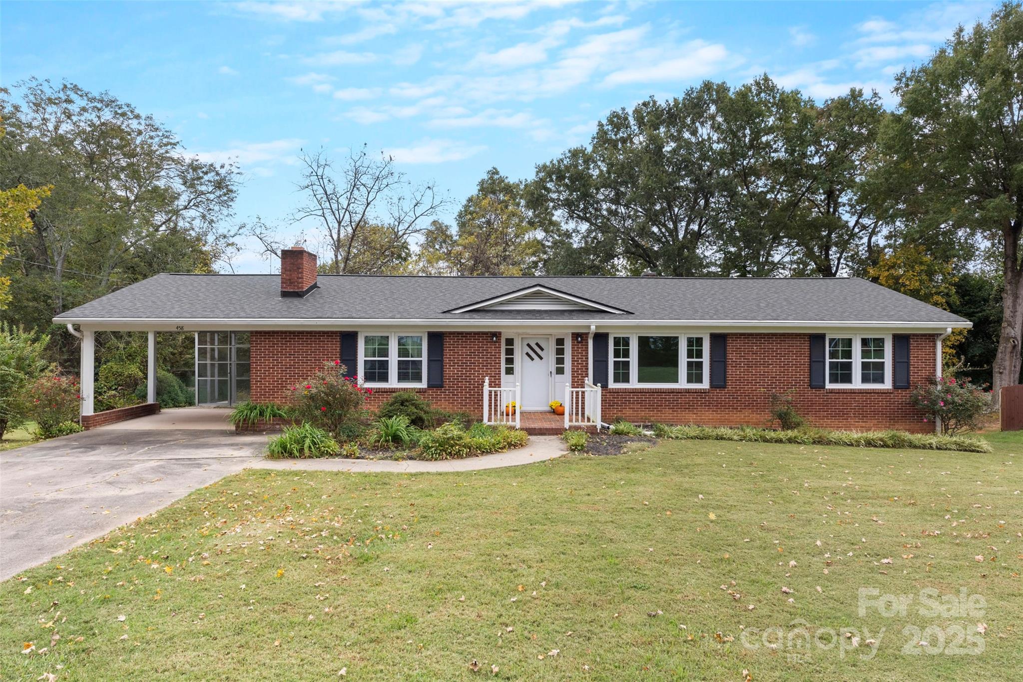 458 Roy Eaker Road Cherryville, NC 28021 - Photo 2 of 33 a front view of a house with a garden