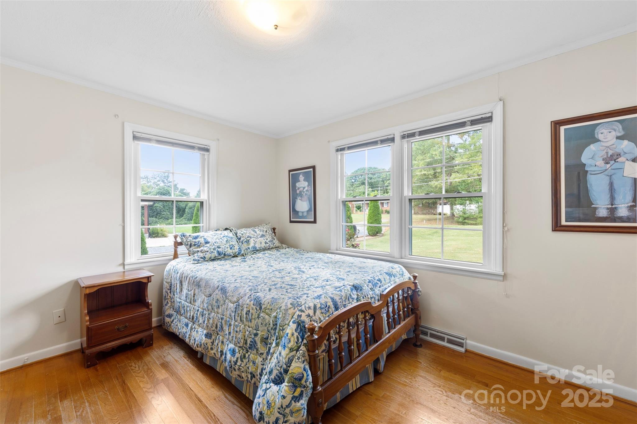 458 Roy Eaker Road Cherryville, NC 28021 - Photo 22 of 33 a bedroom with a bed wooden floor and window