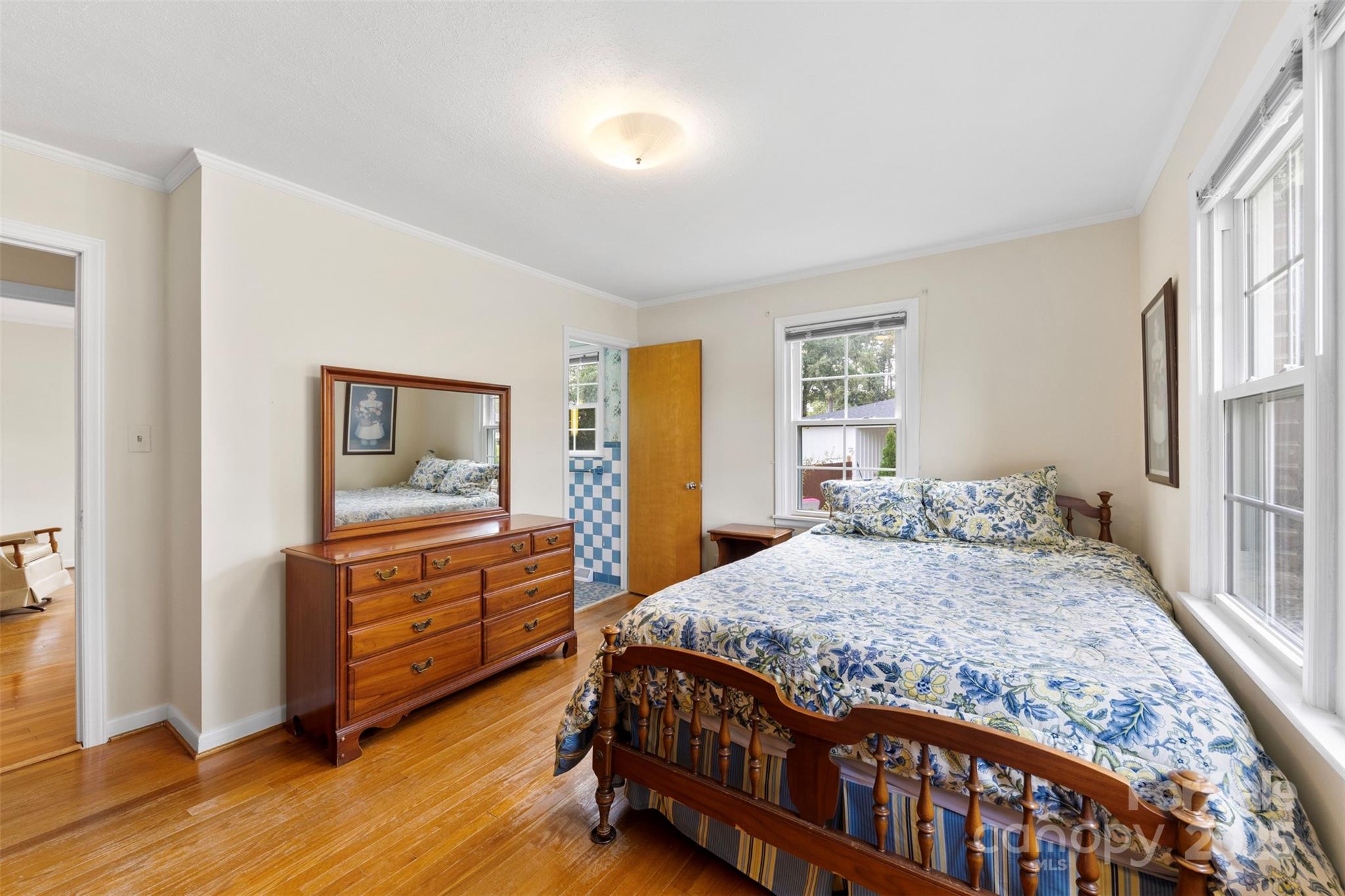 458 Roy Eaker Road Cherryville, NC 28021 - Photo 23 of 33 a bedroom with a bed and wooden floor