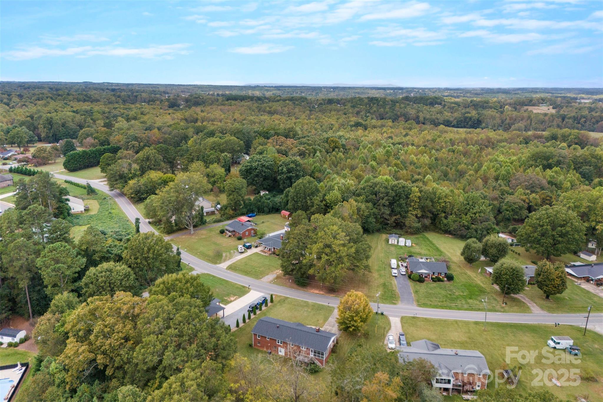 458 Roy Eaker Road Cherryville, NC 28021 - Photo 6 of 33 an aerial view of residential houses with outdoor space and trees