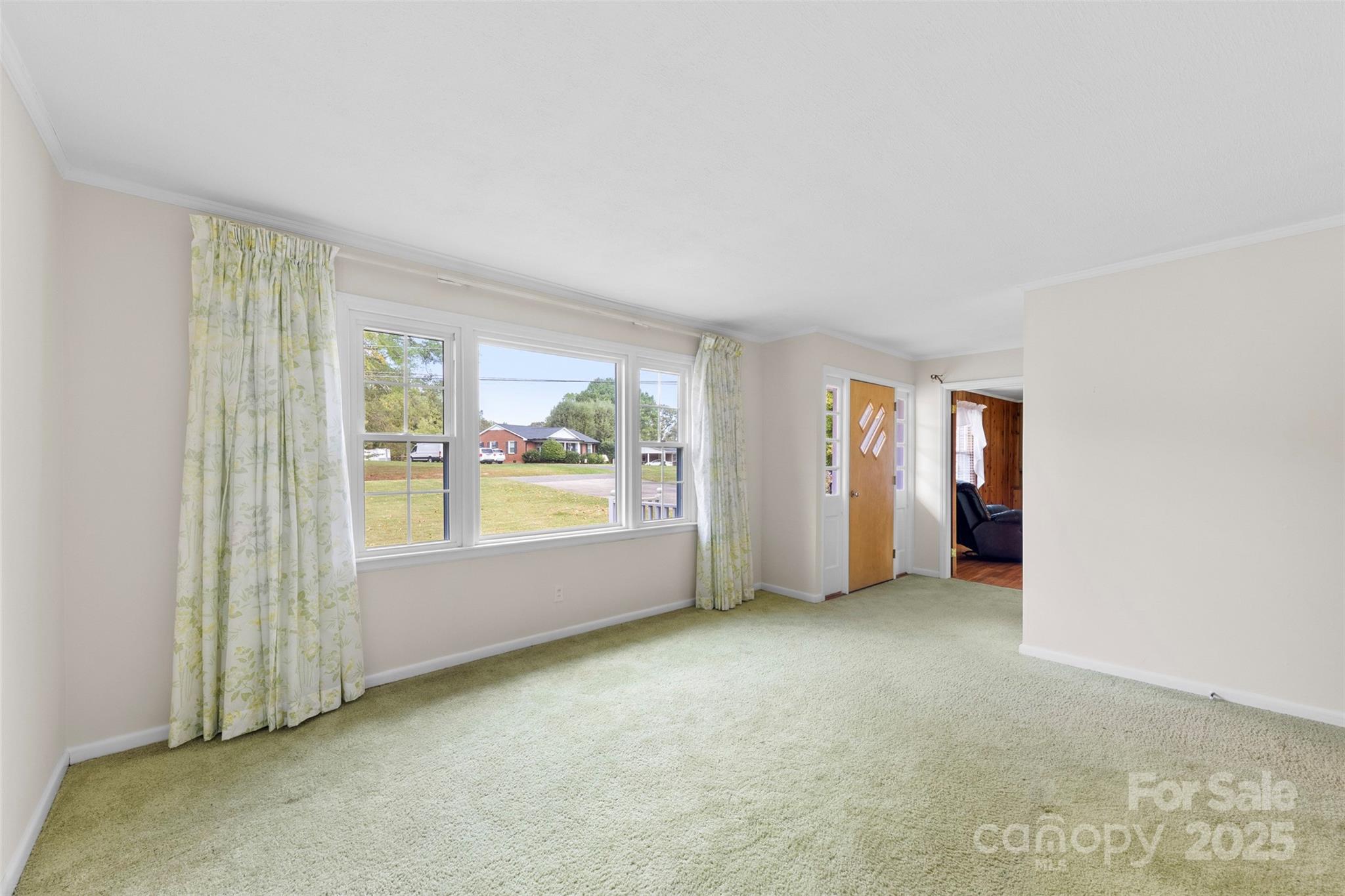 458 Roy Eaker Road Cherryville, NC 28021 - Photo 8 of 33 an empty room with windows