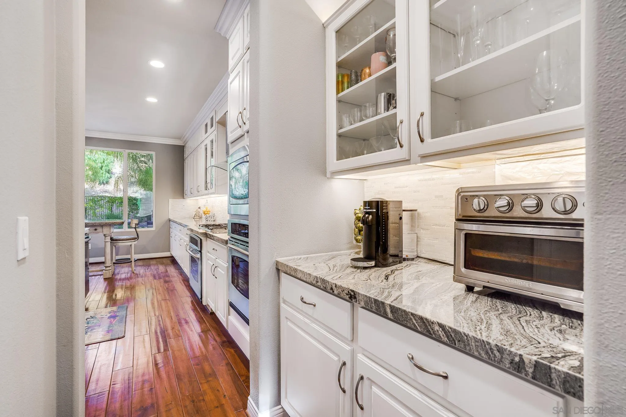 16375 Cayenne Ridge Road San Diego, CA 92127 - Photo 16 of 35 a kitchen with stainless steel appliances granite countertop a stove a sink and a refrigerator