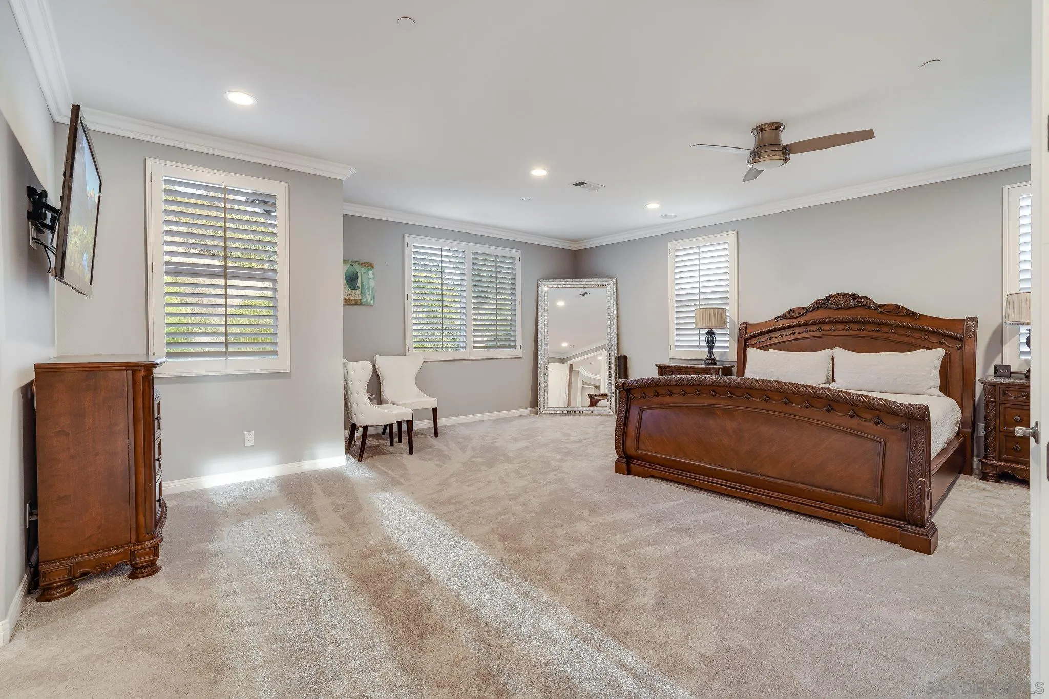 16375 Cayenne Ridge Road San Diego, CA 92127 - Photo 21 of 35 a bedroom with a bed a table and chair