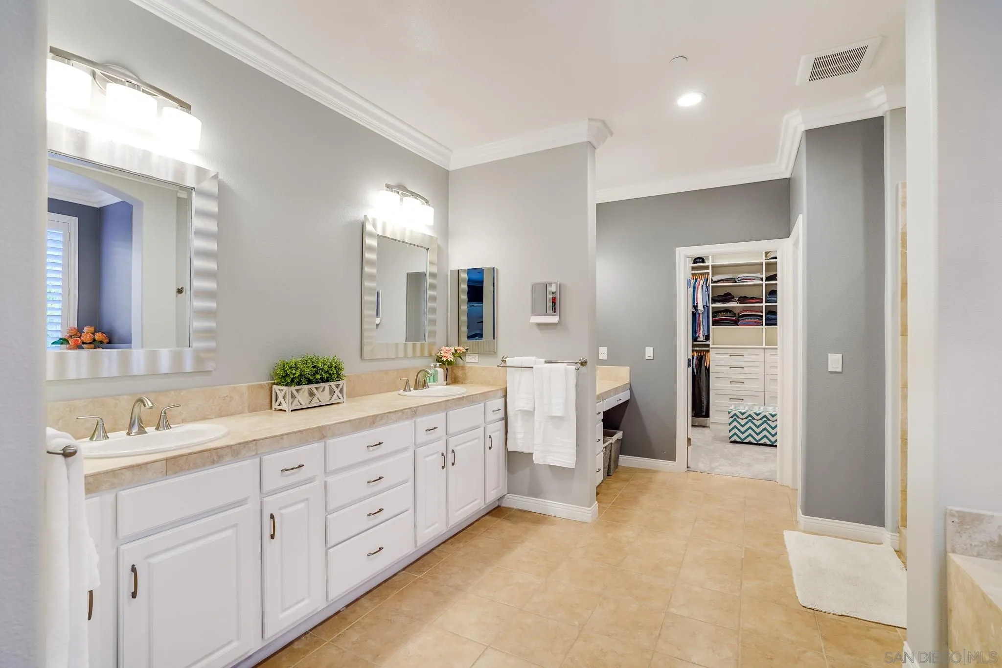 16375 Cayenne Ridge Road San Diego, CA 92127 - Photo 23 of 35 a spacious en suite bathroom with double sink and a mirror